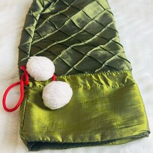 Green Quilted Stocking with White Pom Poms